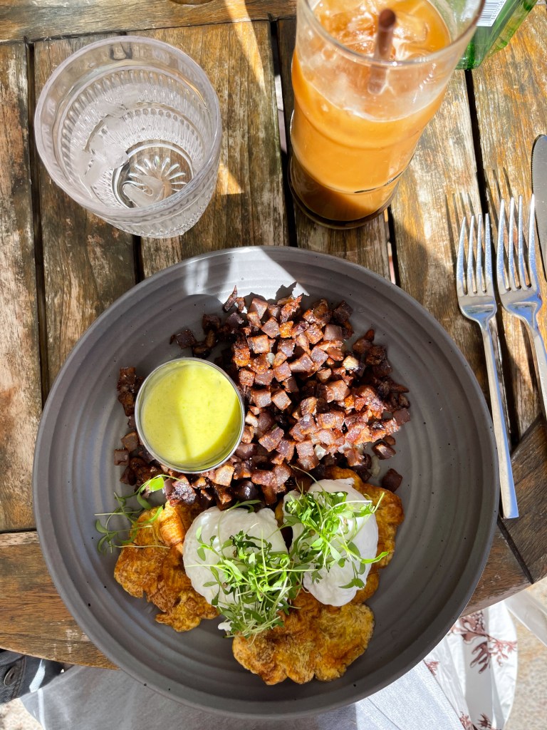 Eggs benedict on fried plantains with purple sweet potato hash from The Canal Club in Scottsdale, Arizona