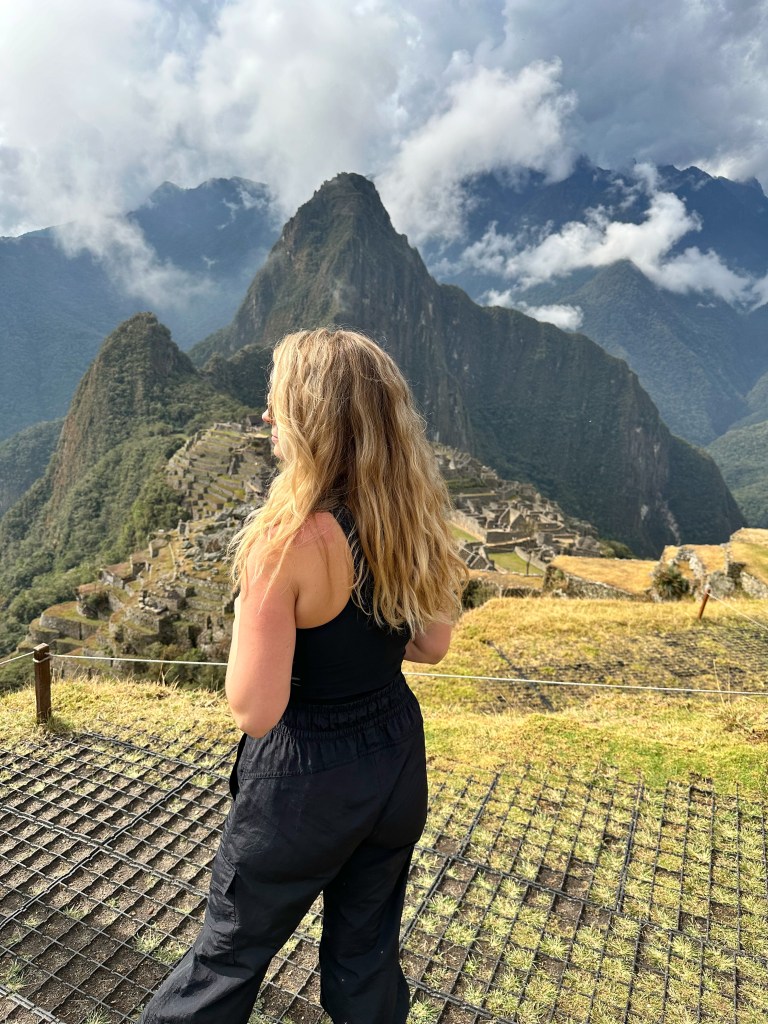 Lauren from The To Go List gazing out at Machu Picchu